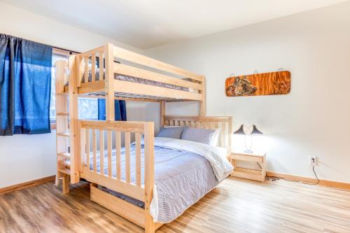 a bedroom with a wooden bunk bed with a ladder at Golden Poles Chalet #110 in Government Camp