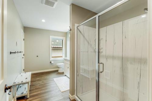 a bathroom with a shower and a toilet at Liberty Bay Loft in Poulsbo