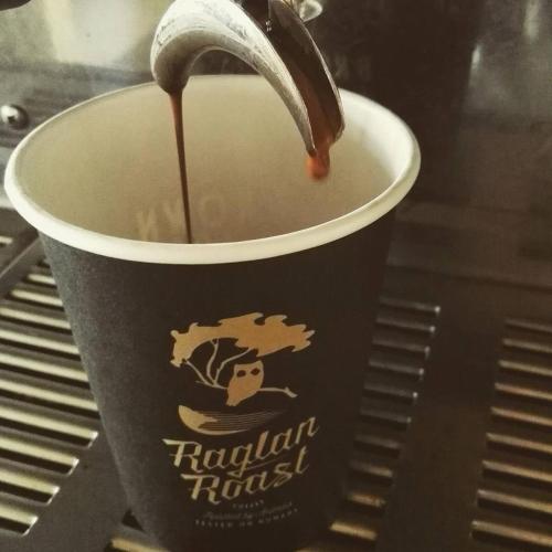 a drink is being poured into a cup at Raglan West Accommodation Units in Raglan