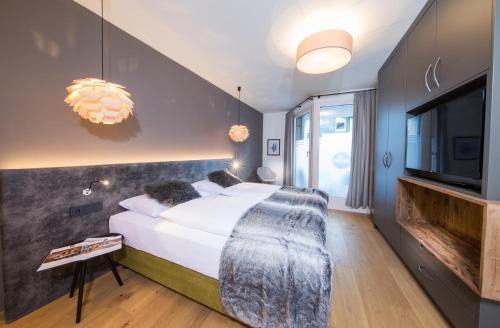 Ein Bett oder Betten in einem Zimmer der Unterkunft TWO TIMEZ - Boutique Hotel