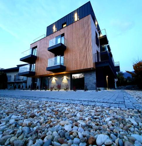 a building with a large pile of rocks in front of it at Villa Olimpijska 2 - Centrum in Wisła