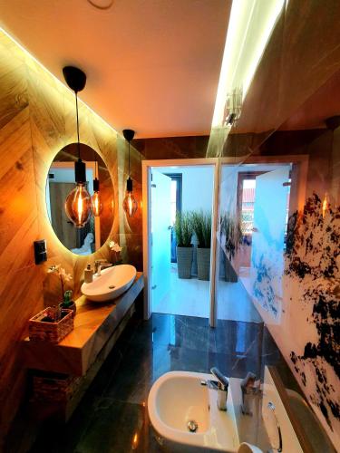 a bathroom with a sink and a mirror at Villa Olimpijska 2 - Centrum in Wisła