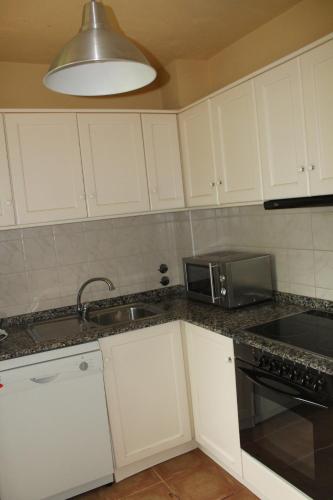 Η κουζίνα ή μικρή κουζίνα στο Hostal Casa Rosita