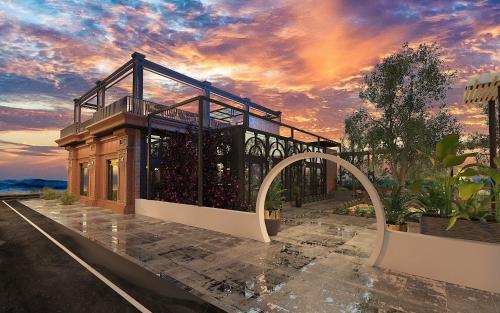 a rendering of a building with a sunset in the background at Binh Minh Dien Chau Hotel in Diễn Châu
