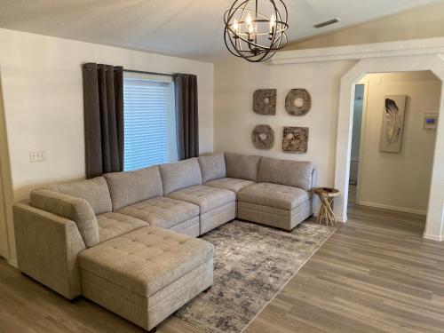 a living room with a couch and a table at THE ACE OF OASIS - Casual And Serene Vacation Home in Lake Havasu City