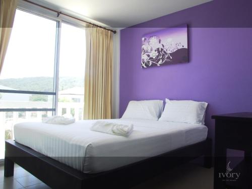Säng eller sängar i ett rum på Ivory Phi Phi Island