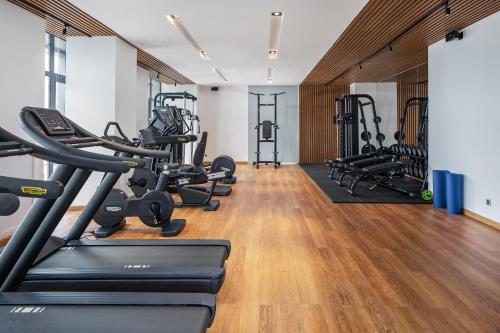 a gym with treadmills and cardio machines at Sensory Park Urban Hotel in Phnom Penh