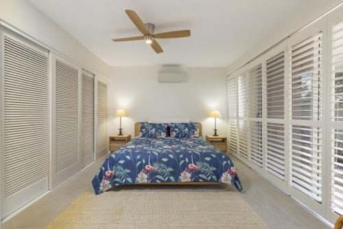 A bed or beds in a room at The Cove Noosa