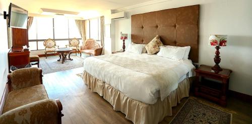 a bedroom with a large bed in a room at Misty Waves Boutique Hotel in Hermanus