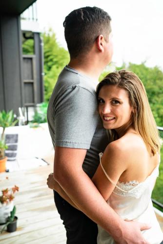 a bride and groom standing next to each other at Wharf Retreat Unit 2 in Tauranga