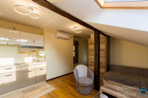 מיטה או מיטות קומותיים בחדר ב-Apartamenty Galicja