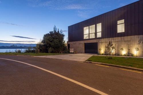 a building on the side of a road at Wharf Retreat Unit 2 in Tauranga
