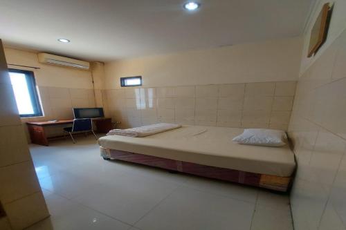 Krevet ili kreveti u jedinici u objektu Hotel Mulia Kendari Mitra RedDoorz