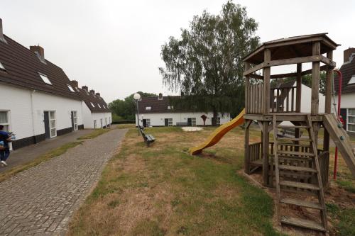 a playground with a slide and a slideintend at Vakantiewoningen Ons Krijtland in Epen