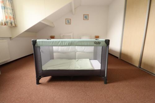 a bunk bed in a room with a staircase at Vakantiewoningen Ons Krijtland in Epen