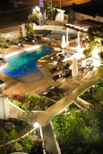an overhead view of a swimming pool at night at Misty Waves Boutique Hotel in Hermanus