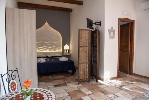 a bedroom with a bed in a room at CASE VACANZE I QUATTROVENTI in Lampedusa