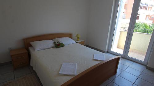Postel nebo postele na pokoji v ubytování Apartment Grahovac 4
