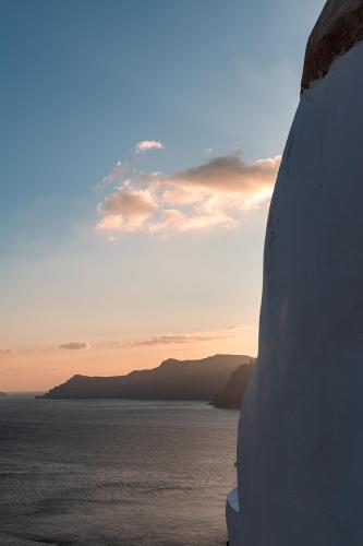 a view of the ocean from the back of a truck at Caldera Premium Villas in Oia