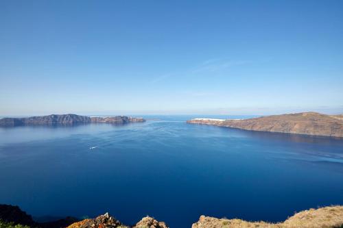 a view of a large body of water at Andromeda Villas & Spa Resort in Imerovigli