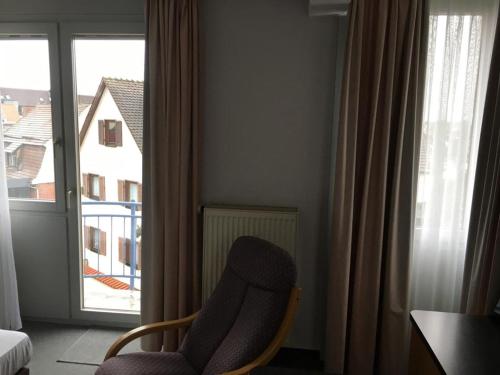 Ein Sitzbereich in der Unterkunft Business apartment in 3 star hotel Daimler Nah