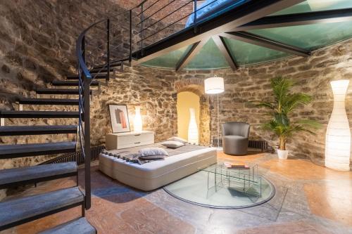 a bedroom with a bed and a staircase at Ice Queen Chamber by Rent All Como in Como