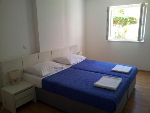 Posteľ alebo postele v izbe v ubytovaní Domenica Apartments