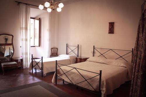 Postel nebo postele na pokoji v ubytování Casa Anna "a lovely home in Tuscany"