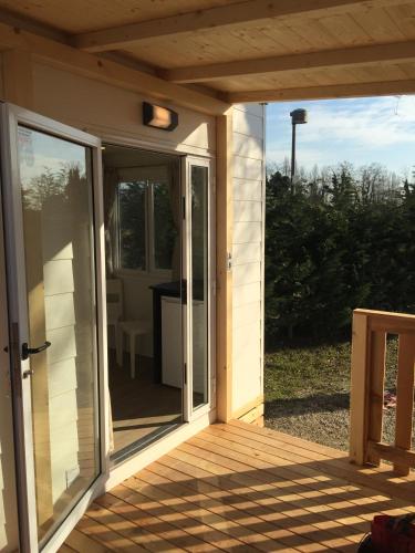 an open sliding glass door on a porch at Camping Venezia Village in Mestre