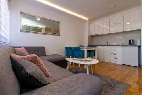 a living room with a couch and a table at Nirvana 06 in Zlatibor