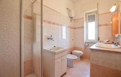 a bathroom with a toilet and a sink and a shower at Charming apartment in Santa Maria, 60 m², sea view in Santa Maria di Castellabate