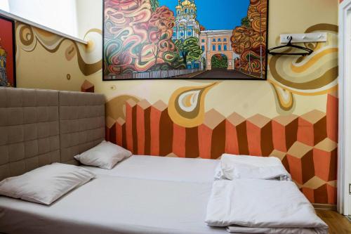 Cama ou camas em um quarto em Aqua Hostel