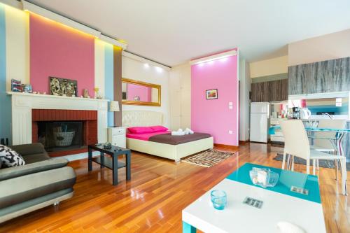 a living room with a bed and a fireplace at La Terra Nostra in Korinthos