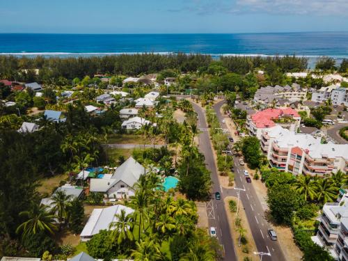 an aerial view of a resort town with the ocean at Hôtel Coco Island in Saint-Gilles les Bains