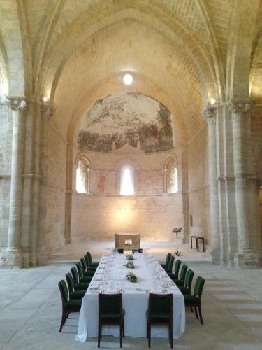 a long table in a large room with chairs at Abadia Retuerta LeDomaine in Sardoncillo