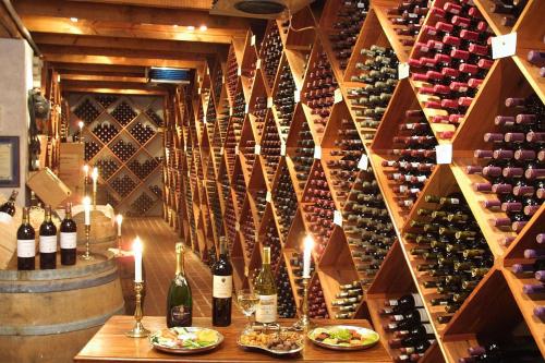 a wine cellar with a bunch of wine bottles at Coach House Hotel & Spa Tzaneen in Tzaneen