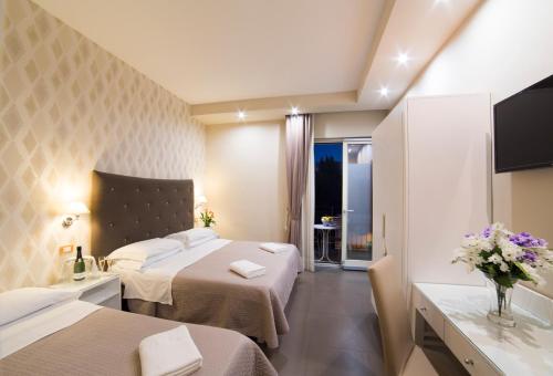 Postel nebo postele na pokoji v ubytování Hotel Club