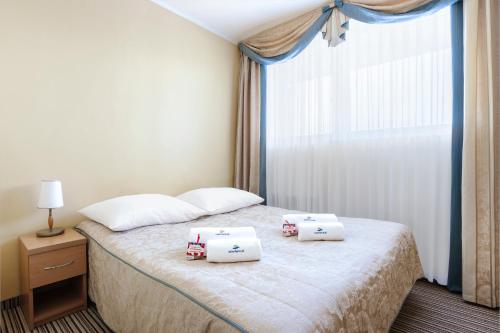 
Łóżko lub łóżka w pokoju w obiekcie Interferie Chalkozyn w Kołobrzegu
