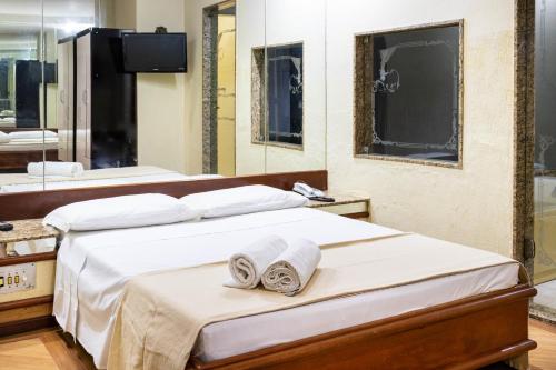 Cama o camas de una habitación en Pompeu Rio Hotel