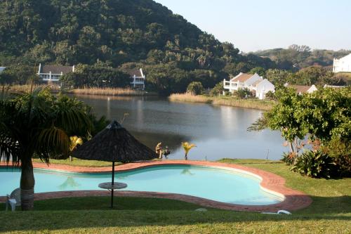 a swimming pool in the middle of a lake at The Estuary Hotel & Spa in Port Edward