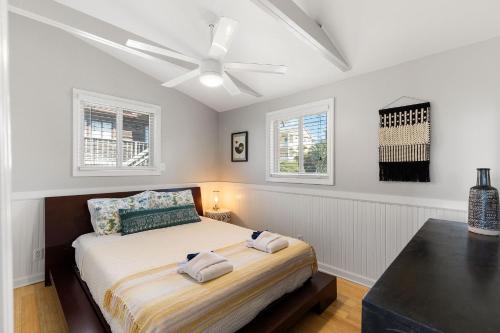 a bedroom with a bed with a ceiling fan at 1684 E Ashley - Sol Searcher - 2 Bedrooms in Folly Beach