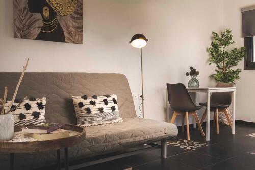 a living room with a couch and a table at Casa Maria in Lithakia