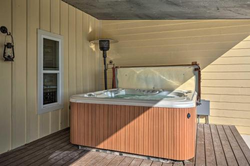 a jacuzzi tub sitting on a wooden deck at Pool, Hot Tub and Game Room Schulenburg Retreat in Schulenburg