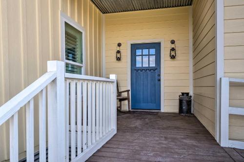 a front door of a house with a blue door at Pool, Hot Tub and Game Room Schulenburg Retreat in Schulenburg