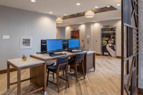 an office with two computer monitors on a desk at Crowne Plaza Hotel St. Louis Airport by IHG in Bridgeton