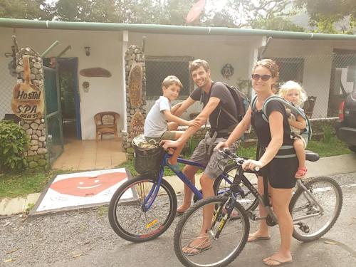 a group of people riding bikes in front of a house at La Casita de Don Daniel in Valle de Anton