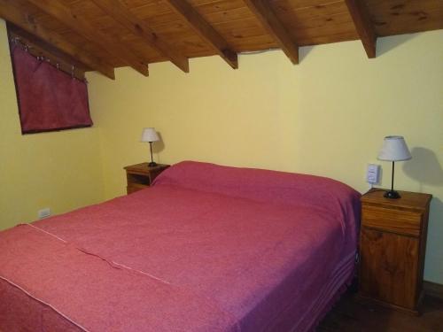 En eller flere senge i et værelse på Sueño del Bosque II