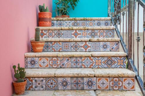 a set of stairs with ceramic tiles on them at BOHO Bohemian Boutique Hotel in Willemstad