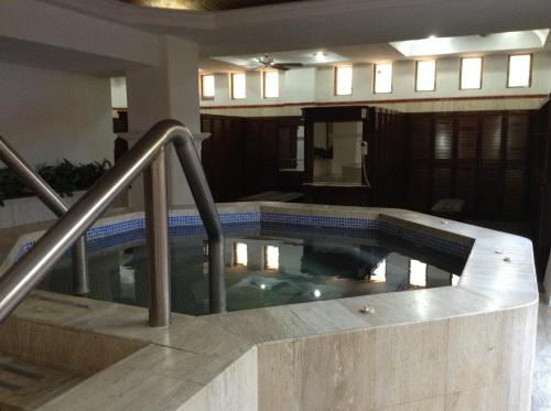 a large swimming pool in a house at Grand Isla Navidad Golf & Spa Resort with Marina in Barra de Navidad