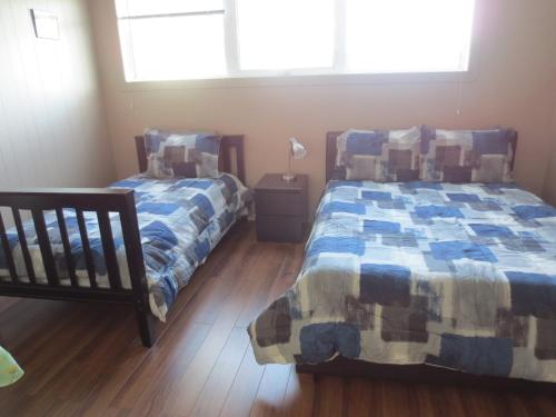 En eller flere senge i et værelse på College Park Bed & Breakfast
